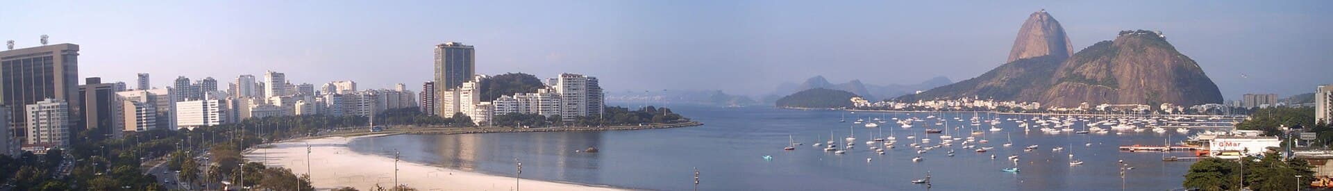 Panoramic view of Botafogo Bay and beach, and Pão de Açúcar (Sugar Loaf mountain) — in Rio de Janeiro.::*Botafogo Bay is a protected side-bay of Guanabara…