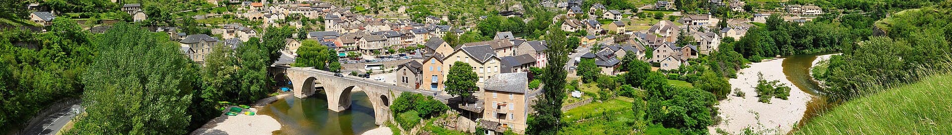 The little village of Sainte-Enimie (Lozère, France) at the entrance of the Gorges du Tarn, seen from a picnic area on D986 road.